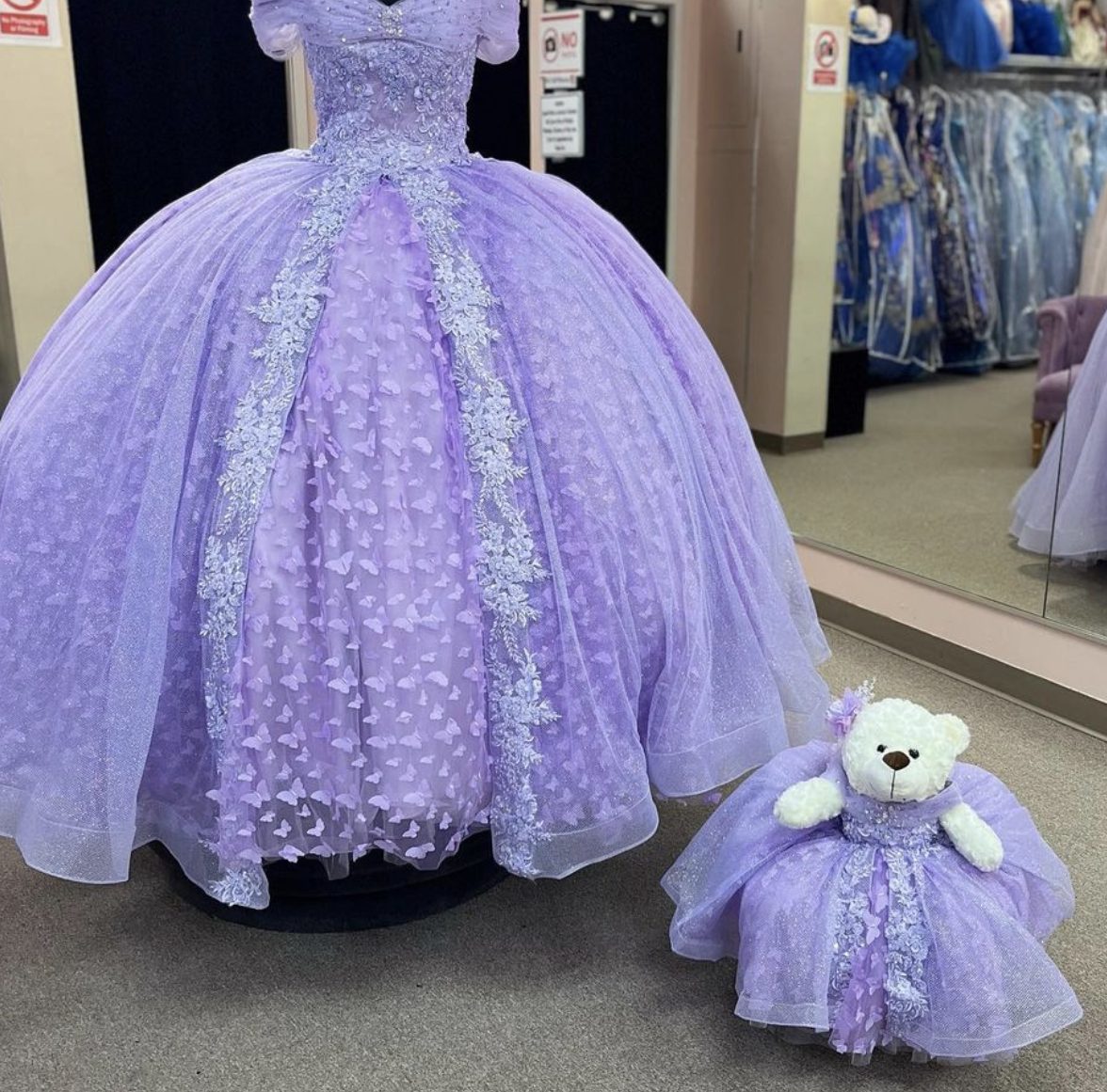 Lavender quinceañera ball gown with matching mini dress on a teddy bear