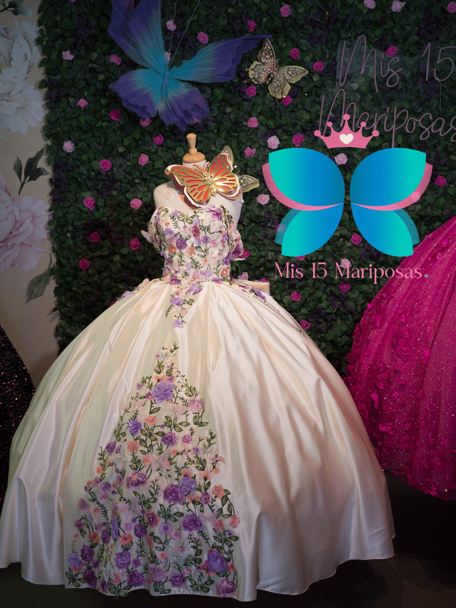 Mis 15 Mariposas cream quinceañera gown with lavender and pink embroidered flowers